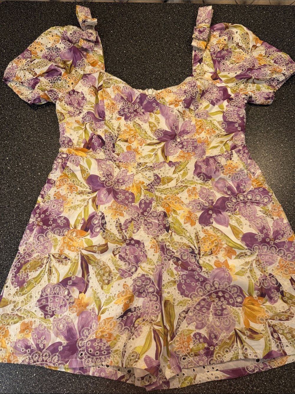 Adelyn Rae Cream Romper with Purple & Yellow Floral Accents
